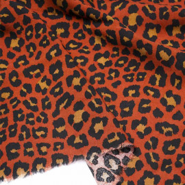 Tissu viscose orange rust à motif léopard noir et caramel |Pretty Mercerie | mercerie en ligne