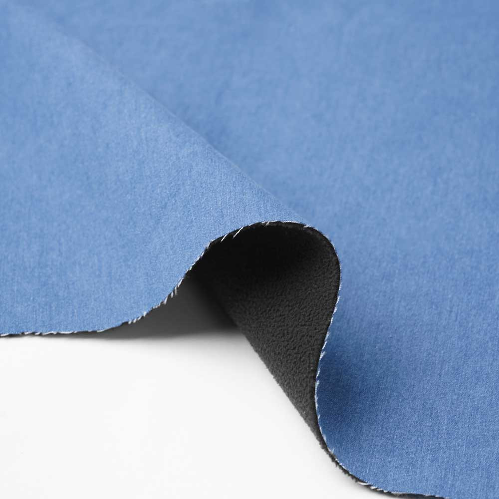 Tissu denim stretch bleu clair à doublure polaire noir | Pretty Mercerie | Mercerie en ligne
