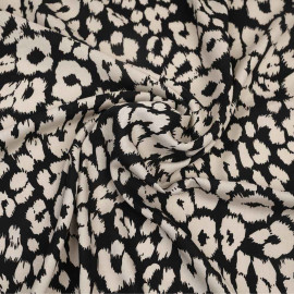 Tissu viscose noir à motif léopard crème