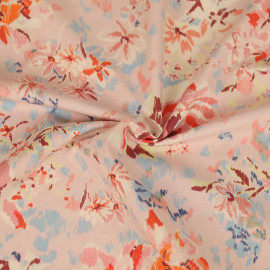 Tissu coton rose pâle à motif floral orange et bleu