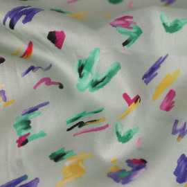 Tissu coton menthe à l'eau à motif graffiti violet, jaune et vert