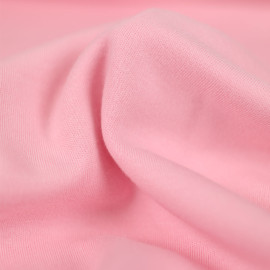 Tissu jersey maille tricoté de coton uni peigné - rose pastel