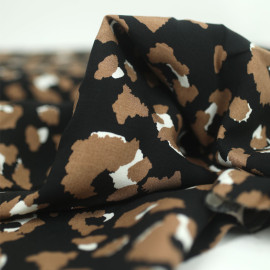 Tissu coton viscose noir et beige à motif Léopard